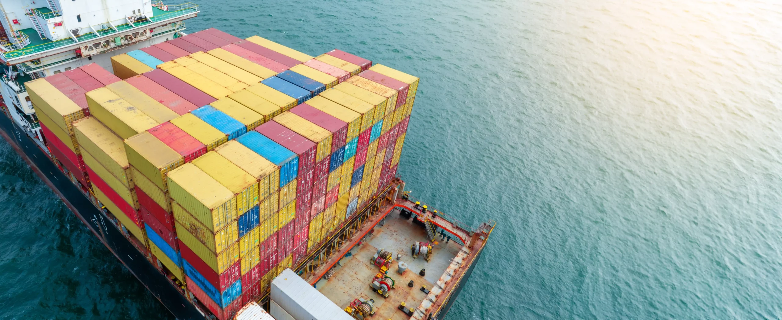 Aerial view of cargo ship loaded with shipping containers in Brisbane waters
