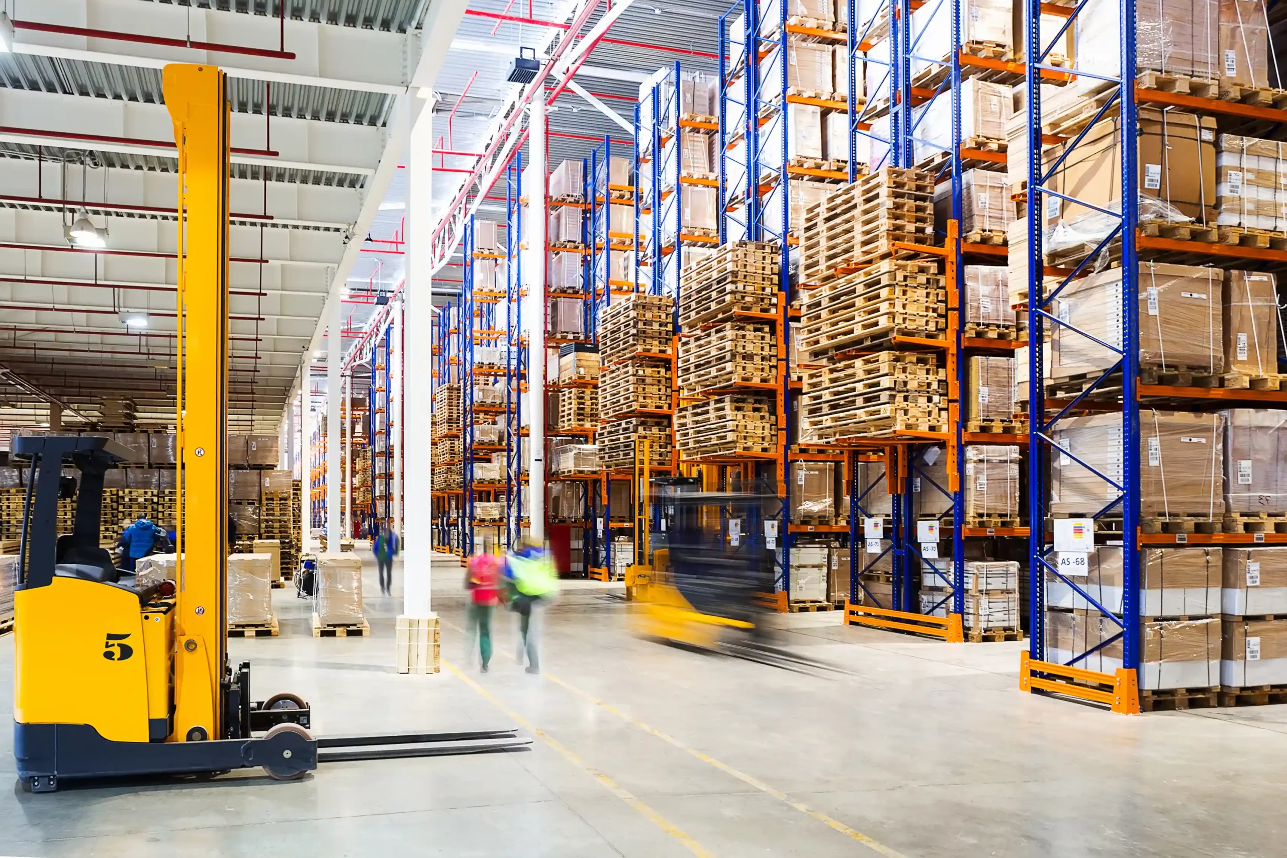 Modern warehouse facility in Brisbane with automated storage systems and workers managing inventory